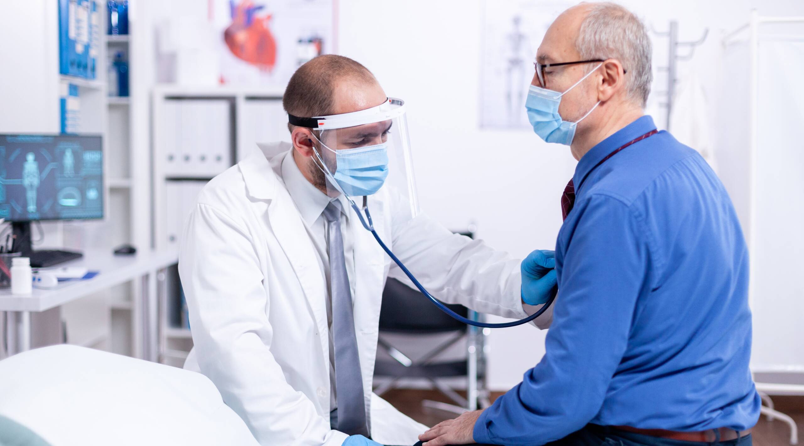 Doctor using stethoscope Annual Physical at Heart and Health Medical